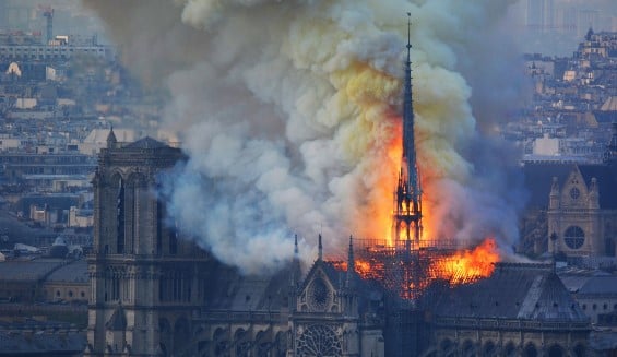 Fire consumed the roof of Notre-Dame Cathedral on April 15. Credit: Hubert Hitier/AFP/Getty via Axios