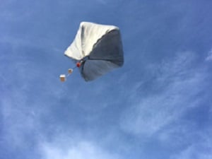 A solar-powered hot air balloon taking flight bears sensors including a GPS tracker and reusable infrasound sensor. Photo courtesy Sandia National Laboratories