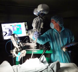 STAR employs a bedside lightweight robot arm extended with an articulated laparoscopic suturing tool for a combined eight-degrees-of-freedom robot. Image credit: Children's National Health System.