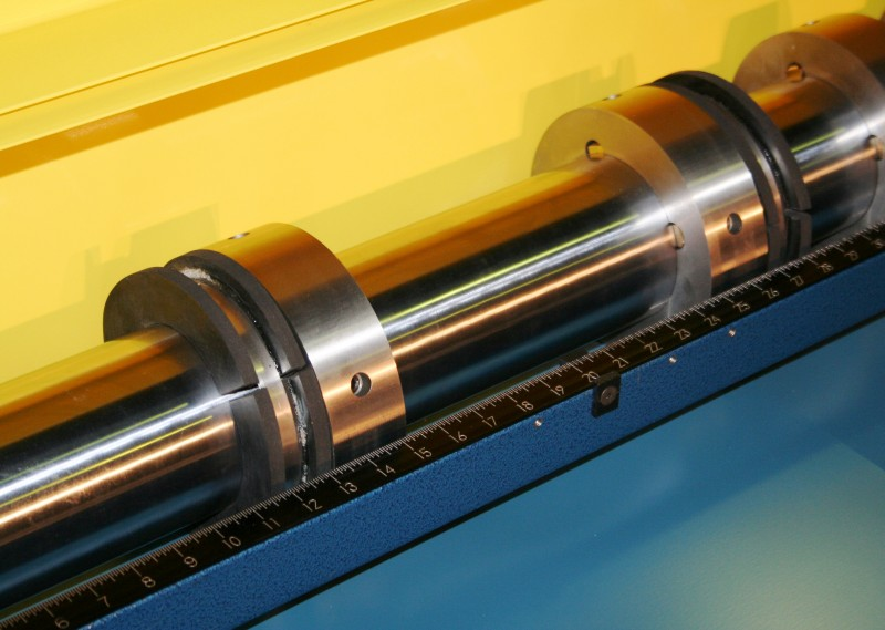 Figure 2. Sheet metal slitting knives on metal coil slitter. Source: Metal Rollforming Systems
