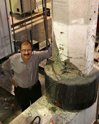 Engineer Chris Pantelides and a “donut” repair to a bridge column.  Image Credit: Dan Hixson/University of Utah College of Engineering.