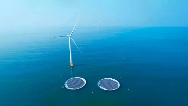 Two floating solar platforms are connected to an offshore wind turbine in the world’s first commercial offshore wind-solar project in the waters off China. Source: Ocean Sun