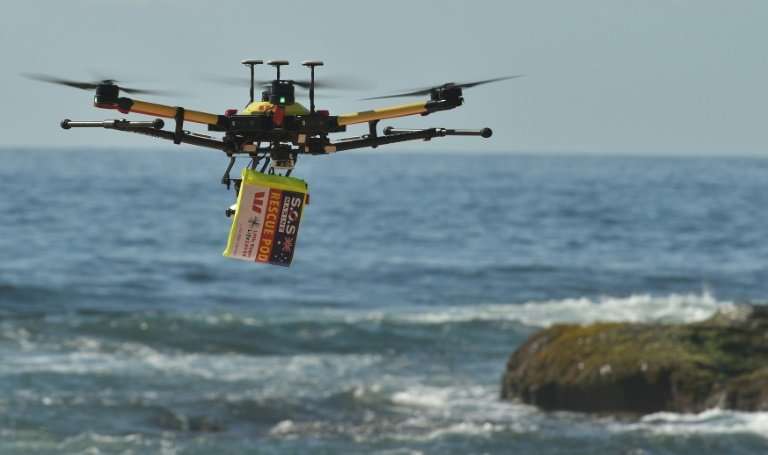 Along with spotting swimmers in trouble and dropping lifesaving devices to them, the drones are being used to spot predators such as sharks. Source: AFP 