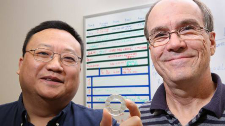 Gang Wang and David Hissam show the prototype piezoelectric washer. Image credit: Michael Mercier/UAH.