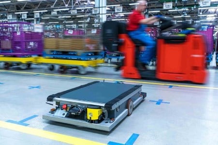 BMW Group tested suitcase sized self-driving robotic trolleys on its factory floors in Germany as part of an automation drive to help cut costs by 5% per car annually.
