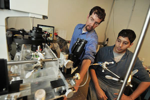 Mark Borden, associate professor of mechanical engineering at CU Boulder (l), and a student work in the laboratory. Image credit: CU Boulder.
