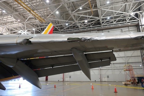 Damage to leading edge of the wing.