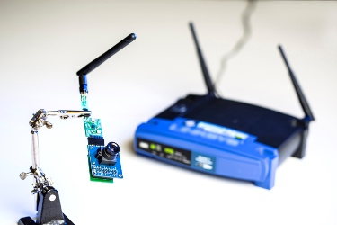 The UW team used ambient signals from this Wi-Fi router to power sensors in a low-resolution camera and other devices. Image credit: Dennis Wise/University of Washington.