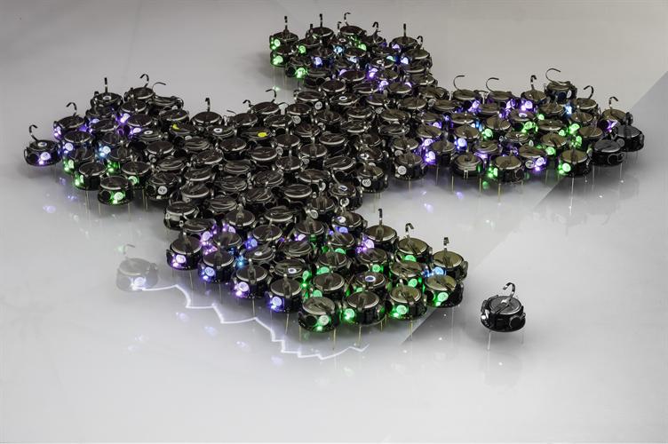 Swarm robots used during the experiments, shaped into a hand-made illustration of the technique. Source: AAAS
