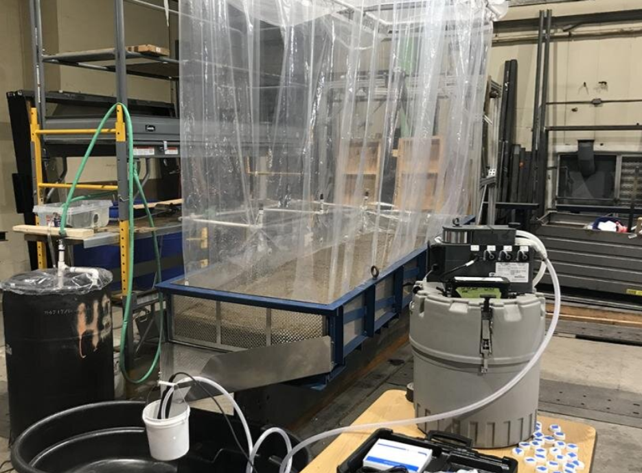 Pictured is the lab where rainfall-runoff experiments were conducted on a roadbed test frame with a discharge chute to capture runoff. Source: Penn State