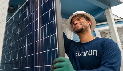 A Sunrun technician installs a rooftop solar panel in Puerto Rico. Source: Sunrun