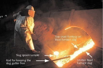 Figure 4. Operator sampling and draining off iron blast furnace slag. Source: ZKG International
