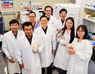 Bin Yang (center) patented a catalytic process to convert lignin into jet fuel hydrocarbons. Image credit: WSU.