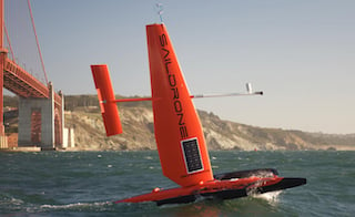 The Saildrone incorporates a nearly-20-foot-high carbon-fiber wing to help it sail at speeds of up to 16 mph while carrying up to 200 lbs. of instrumentation. Image credit: Saildrone.