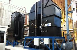 Figure 1: 2,500 SCFM Regenerative Thermal Oxidizer (RTO) preceded by a Coalescing Fiberbed Mist Collector System controlling emissions from an asphalt roofing and shingle manufacturing process. The mist collector protects the RTO’s ceramic media from fouling. Source: Air Clear