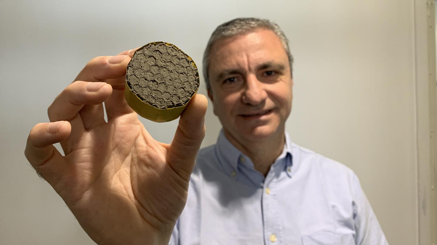 Professor Michele Meo with lightweight aerogel suspended in a honeycomb structure. Source: University of Bath