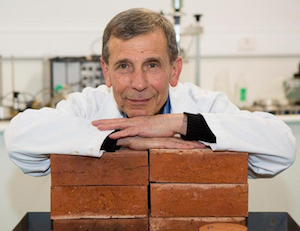 Dr. Abbas Mohajerani in his lab with the fired-clay bricks. Image credit: RMIT.