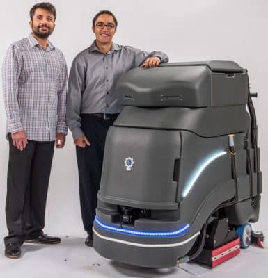 Avidbots founders, from left, Faizan Sheikh and Pablo Molina with Neo, a commercial floor-cleaning robot. Source: Avidbots