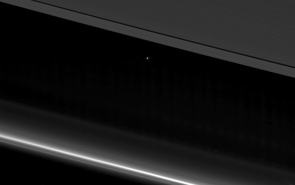 Earth seen from from Cassini. Saturn ring on top. Credit: Reuters