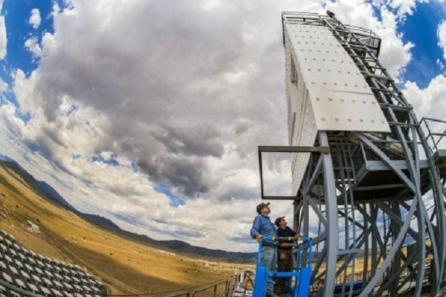 Technologists perform inspections of the falling-particle receiver during a 6cloud delay atop the National Solar Thermal Test Facility’s Solar Tower at Sandia National Laboratories. Source: Randy Montoya