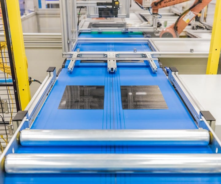 At the inspection and trimming station of SABIC and Airborne’s Digital Composite’s Manufacturing Line, the top side of thermoplastic composite laminates are inspected and trimmed, then flipped over by a robot to repeat the process on the bottom side. Source: SABIC
