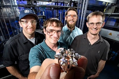 Sandia National Laboratories researchers, from left, Nathan Harry, Christopher Nilsen, Drummond Biles and Charles Mueller show off the prototype ducted fuel injection module. Source: Randy Wong