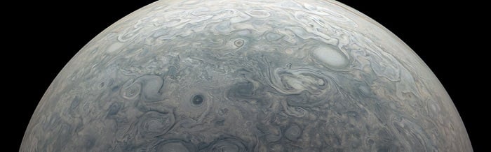 An image from NASA’s Juno mission captures the northern hemisphere of Jupiter, where strong winds create the many swirling storms visible near the top of its atmosphere. Source: NASA/Jet Propulsion Laboratory-Caltech/Southwest Research Institute/MSSS/Kevin M. Gill