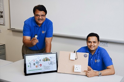 Researchers display a prototype of the smart electrical outlet/socket system. Source: National University of Singapore