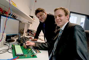 Ruhr University researcher Philip Dost (r) and Constantinos Sourkounis , professor in the Faculty of Electrical Engineering and Information Technology, have developed technology that requires only one voltage sensor per EV battery. Image credit: &copy;RUB, Marquard.