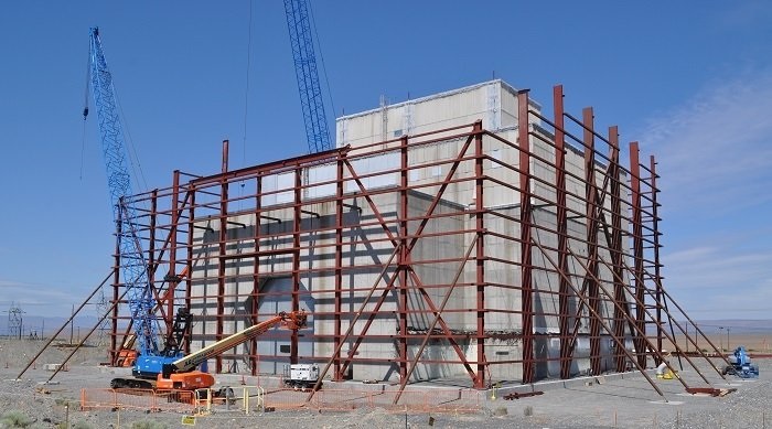 Steel columns, each weighing up to 28 tons, rise around the reactor. Source: DOE