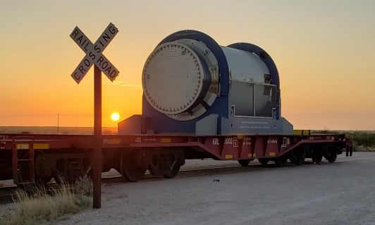 The cask, loaded on a flatcar, undergoes testing in Texas. Source: Orano