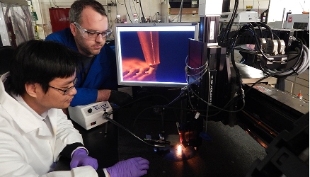 LLNL's Cheng Zhu (left) and Kyle Sullivan used additive manufacturing to print custom electrically conductive substrates. Image credit: LLNL.