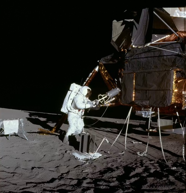 Apollo 12 astronaut Alan Bean extracts the fuel element of a radioisotope thermoelectric generator from the lunar module. Source: NASA